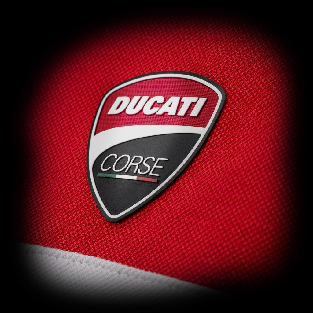 Polo rossa, bianca e nera con badge Ducati Corse Ally