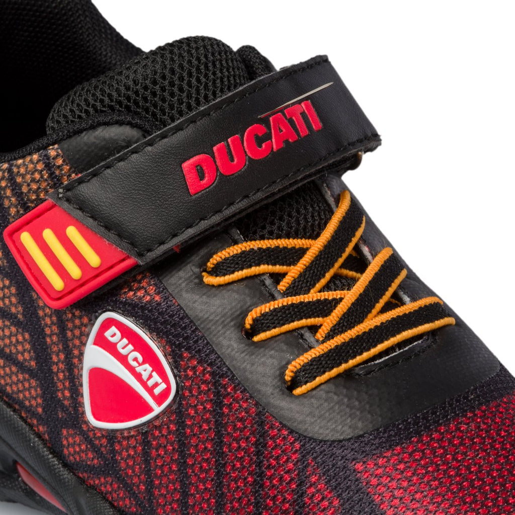 Sneakers nere e arancioni con luci sulla suola Ducati